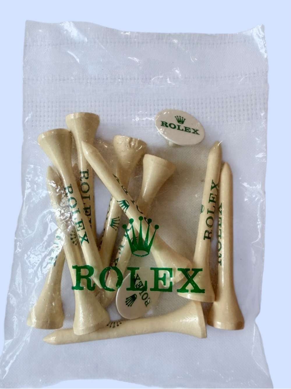 Rolex Branded Ten Golf Tees & Two Ball Markers Green Lettering Crown Logo Sealed